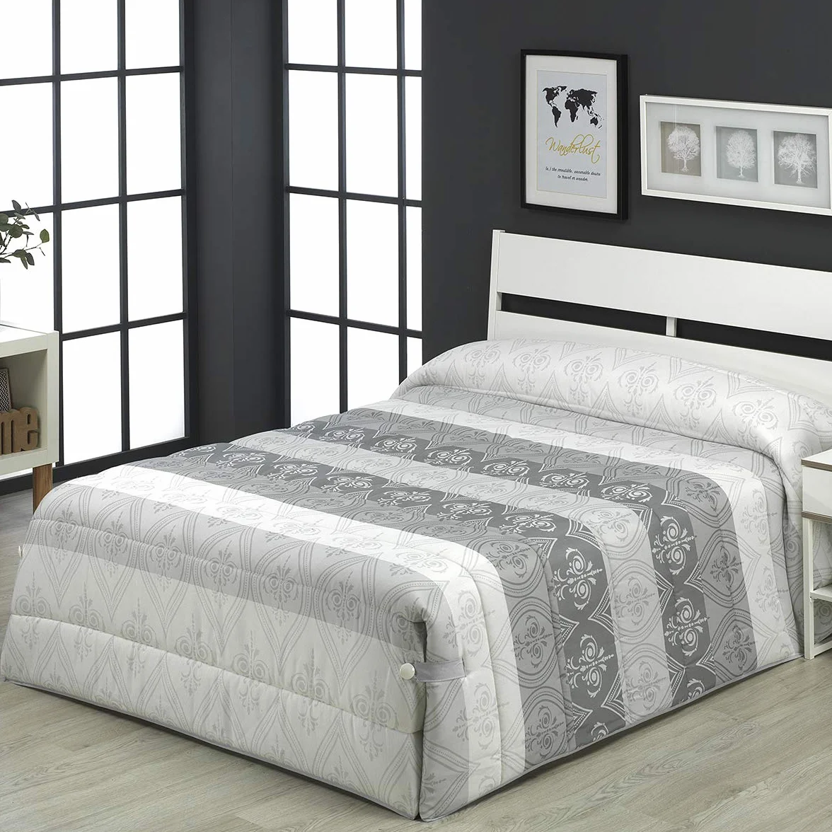 Edredón Conforter Greta Beig Lanovenanube Cama 90 Diseño Estampado | Tejido 50% algodón y 50% poliéster. Cintas con botones laterales. Diseño con bloques de color y arabescos. No incluye cojín.